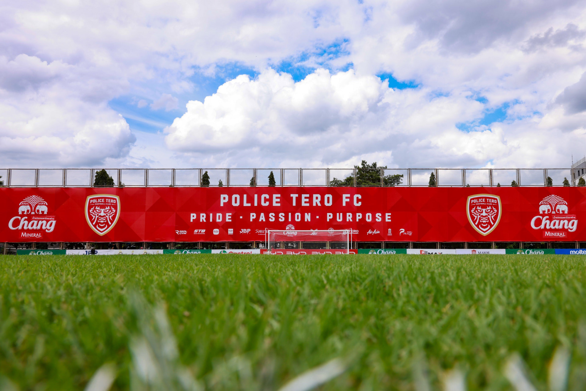 NT Stadium pitch with Police Tero FC pride, passion, purpose banner